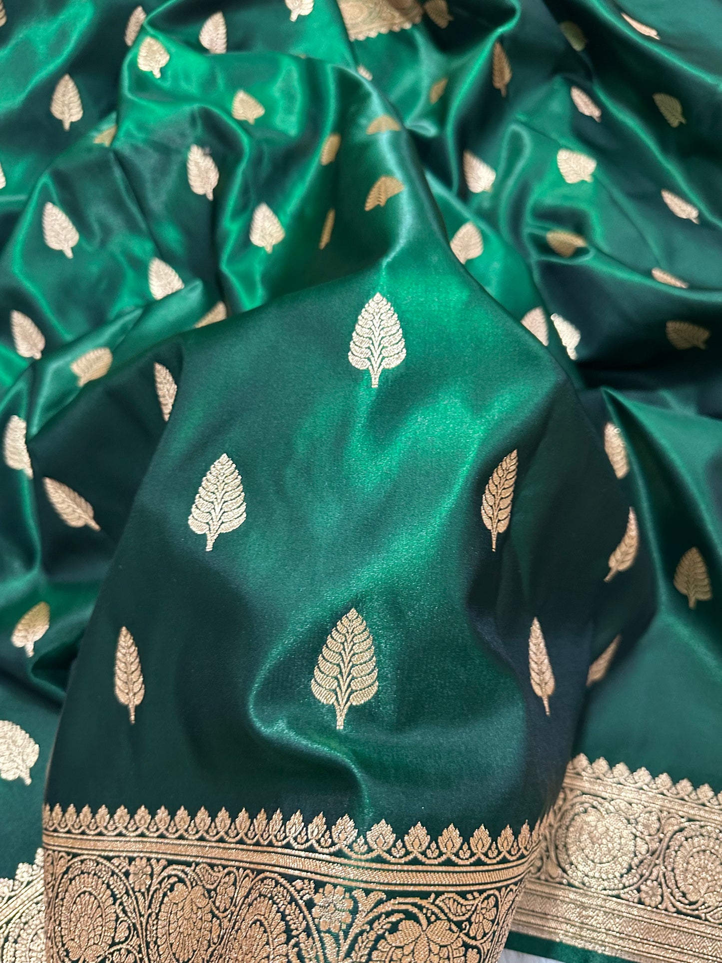 Bottle Green Satin Silk Banarasi Saree with Royal Guldasta Chakra Border and Bold Gold Panna Butis