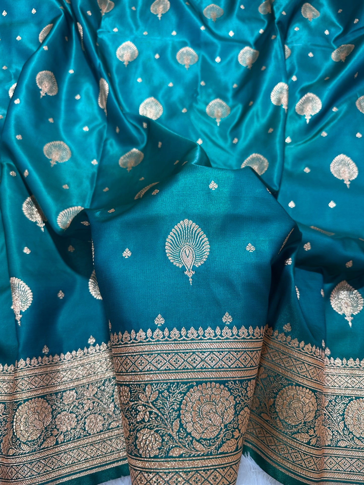 Elegant Rama Green Satin Silk Banarasi Saree with Royal Meena-Floral Border and Ornate Peacock Feather Butis