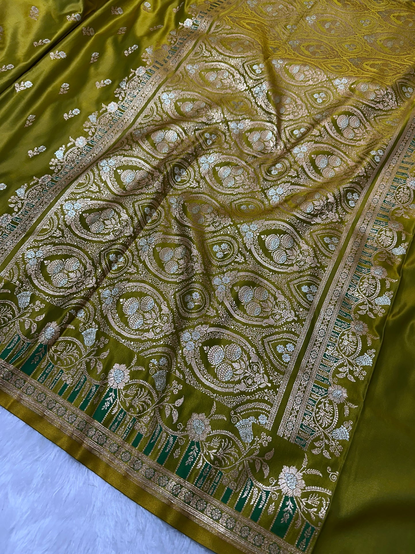 Premium Mehndi Green Banarasi Silk Saree With Elegant Double Zari Buti Border