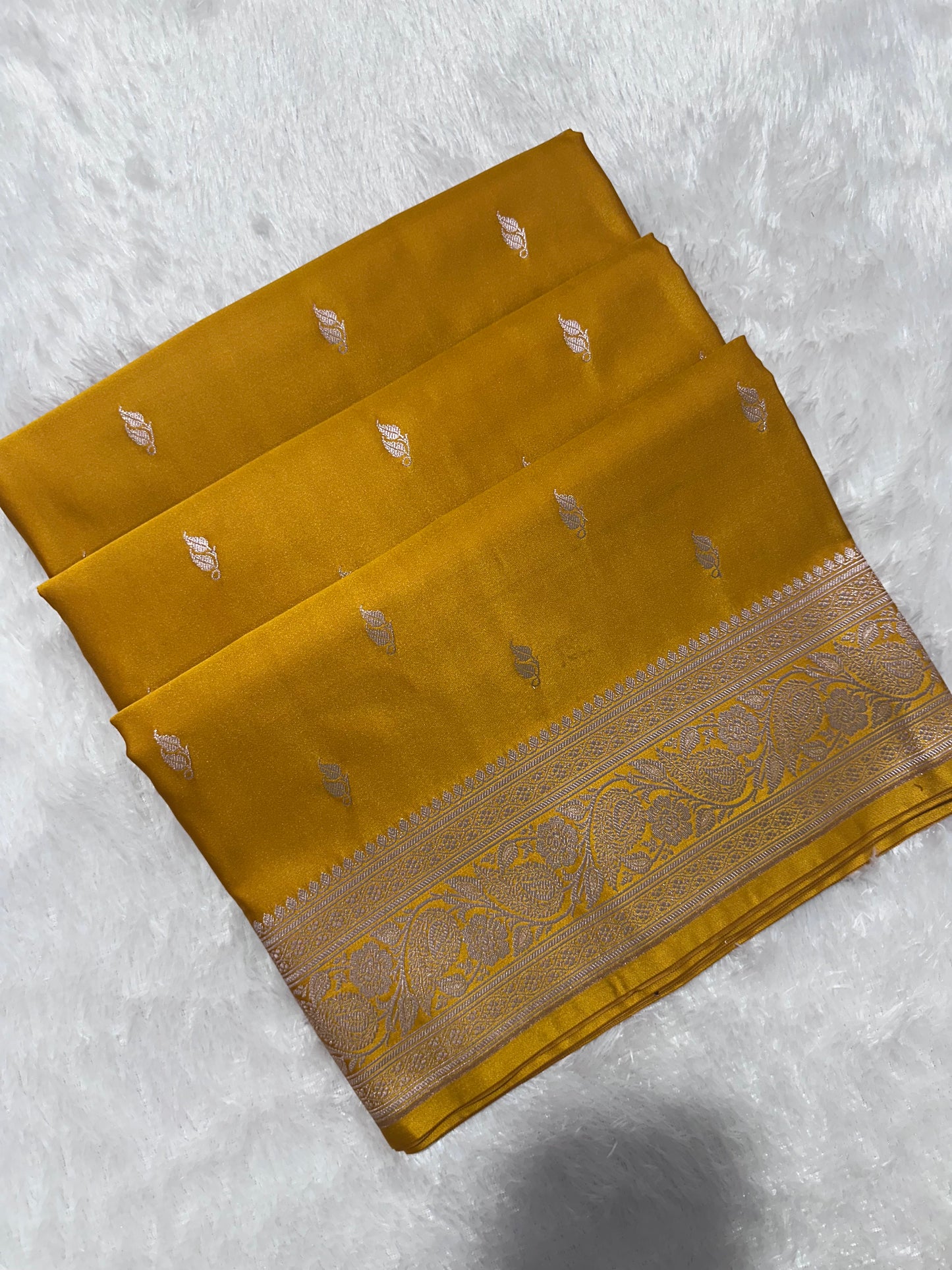 Mustard Yellow Katan Silk Banarasi Saree with Classic Copper Zari Kalka Bel Border and Sleek Leaf Sprigs