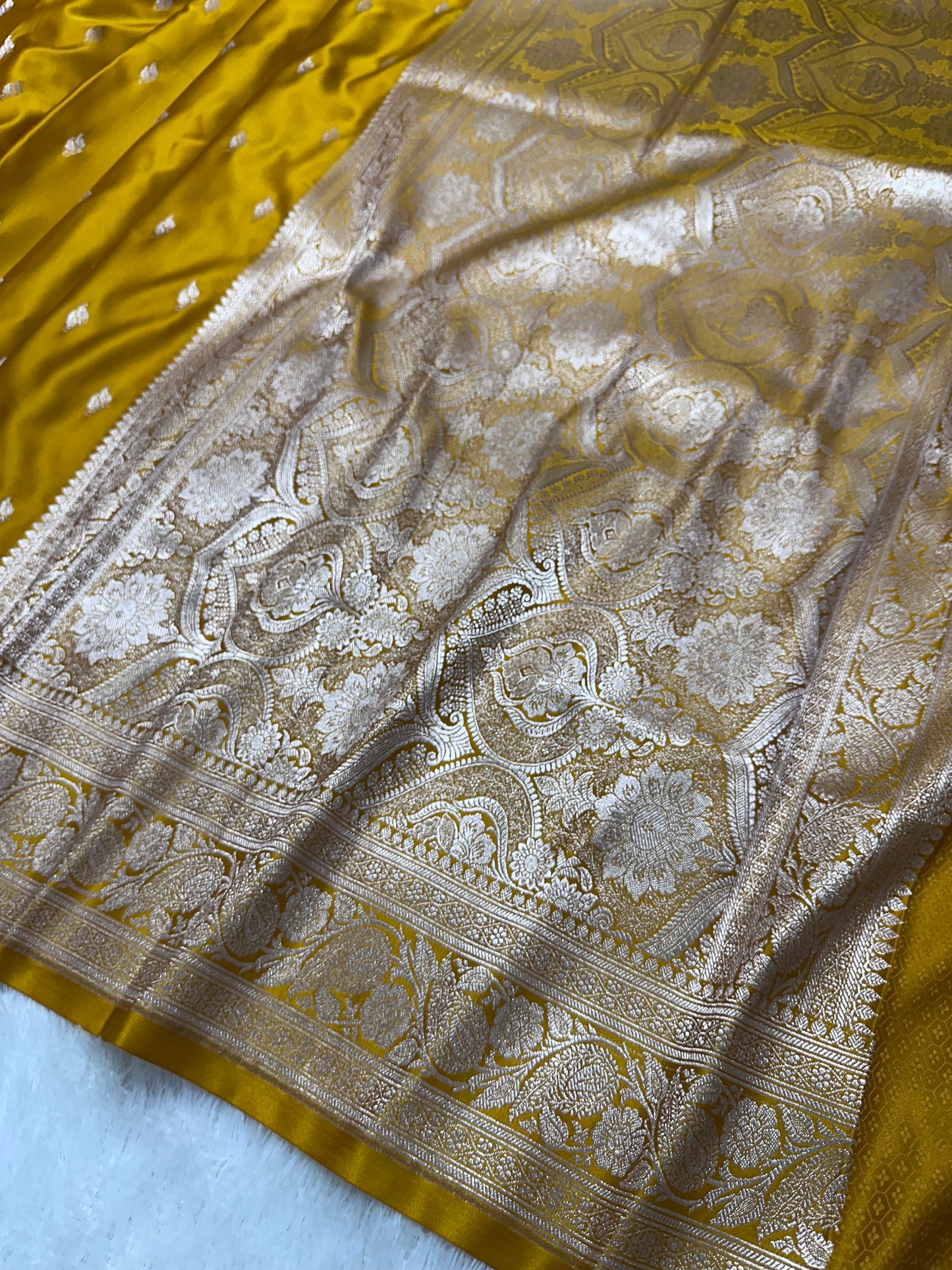 Mustard Yellow Katan Silk Banarasi Saree with Classic Copper Zari Kalka Bel Border and Sleek Leaf Sprigs