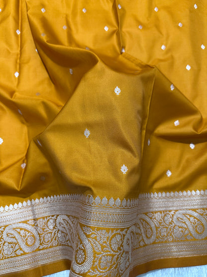 Mustard Orange Katan Silk Banarasi Saree with Classic Copper Zari Kalka Bel Border and Sleek Micro-Butis