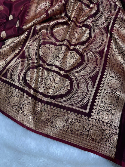 Garnet Satin Silk Banarasi Saree with Royal Guldasta Chakra Border and Bold Gold Panna Butis