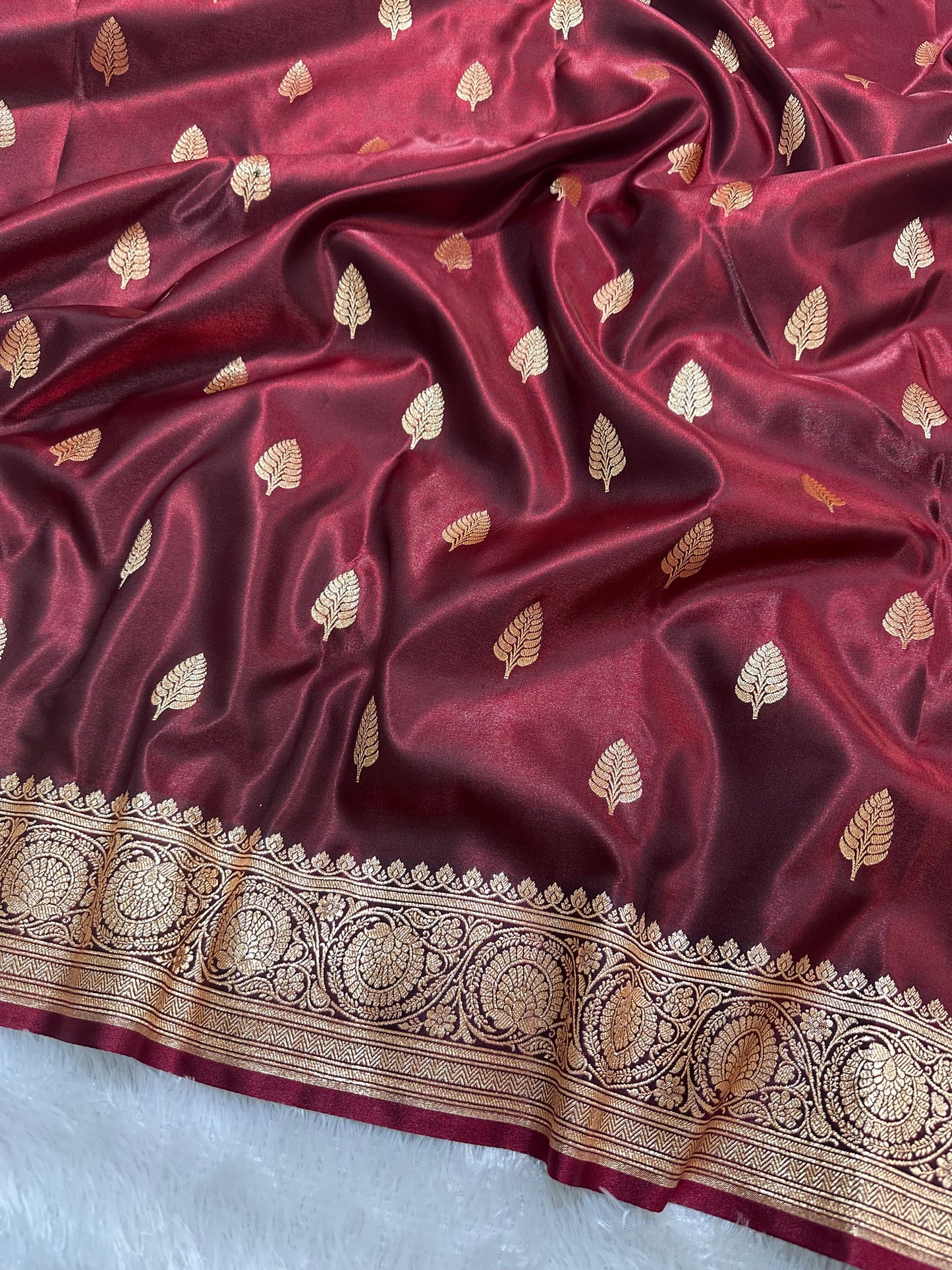 Garnet Satin Silk Banarasi Saree with Royal Guldasta Chakra Border and Bold Gold Panna Butis
