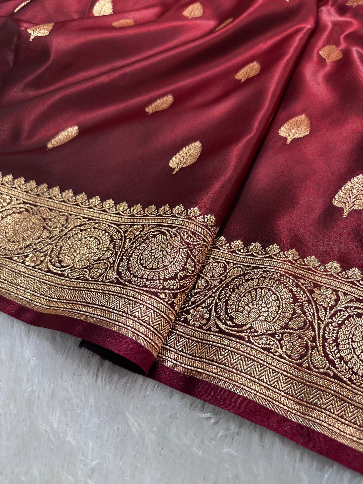 Garnet Satin Silk Banarasi Saree with Royal Guldasta Chakra Border and Bold Gold Panna Butis