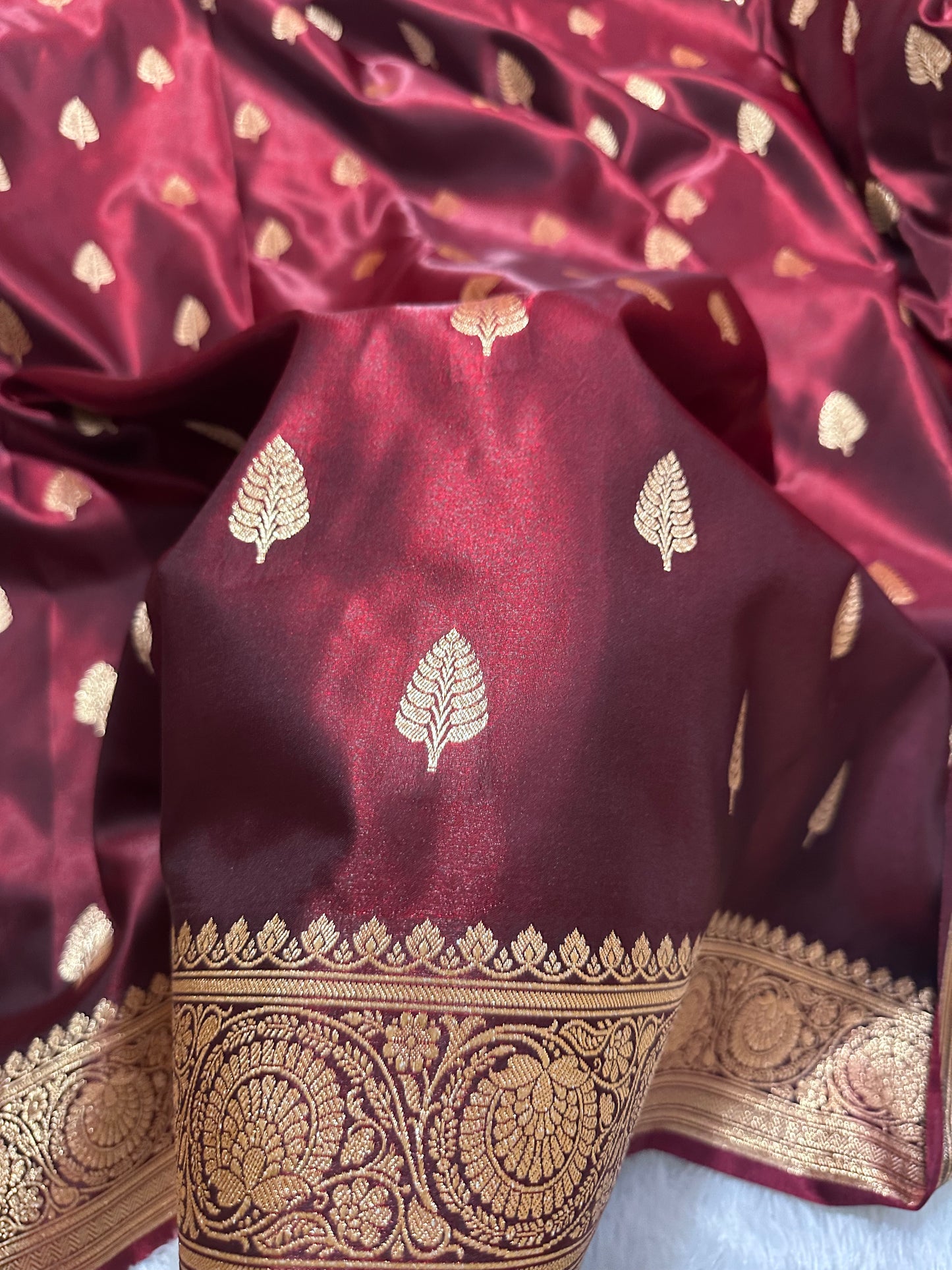 Garnet Satin Silk Banarasi Saree with Royal Guldasta Chakra Border and Bold Gold Panna Butis