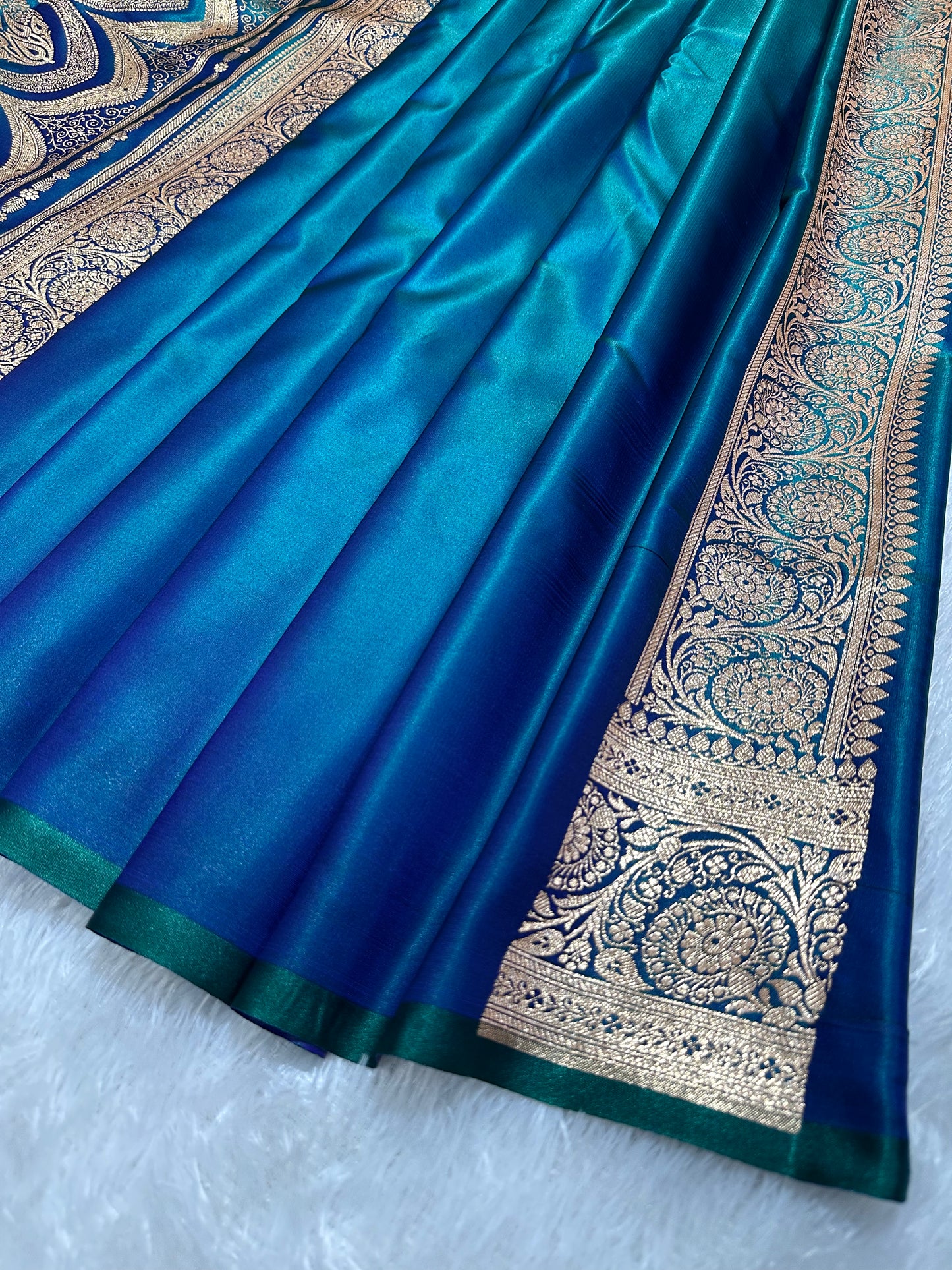 Peacock Dual-Tone Satin Silk Banarasi Saree with Royal Guldasta Chakra Border and Bold Gold Panna Butis