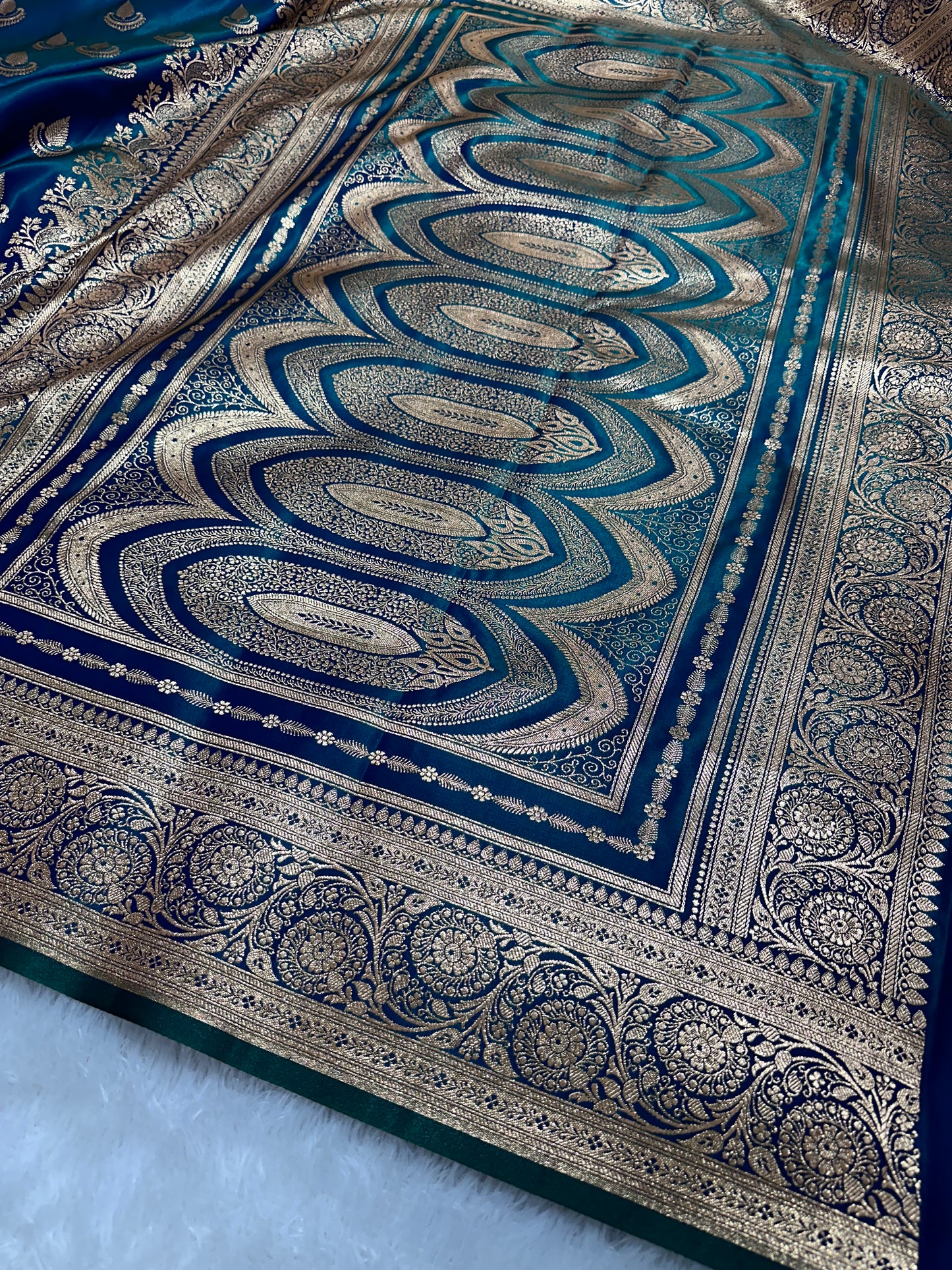 Peacock Dual-Tone Satin Silk Banarasi Saree with Royal Guldasta Chakra Border and Bold Gold Panna Butis