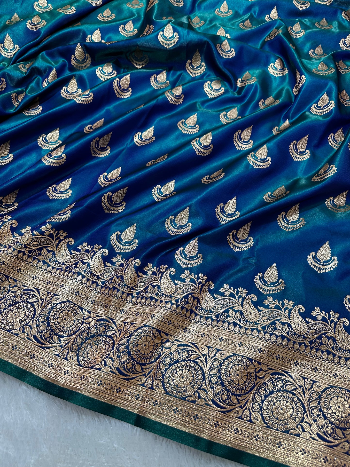 Peacock Dual-Tone Satin Silk Banarasi Saree with Royal Guldasta Chakra Border and Bold Gold Panna Butis