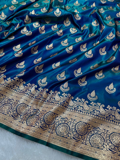 Peacock Dual-Tone Satin Silk Banarasi Saree with Royal Guldasta Chakra Border and Bold Gold Panna Butis