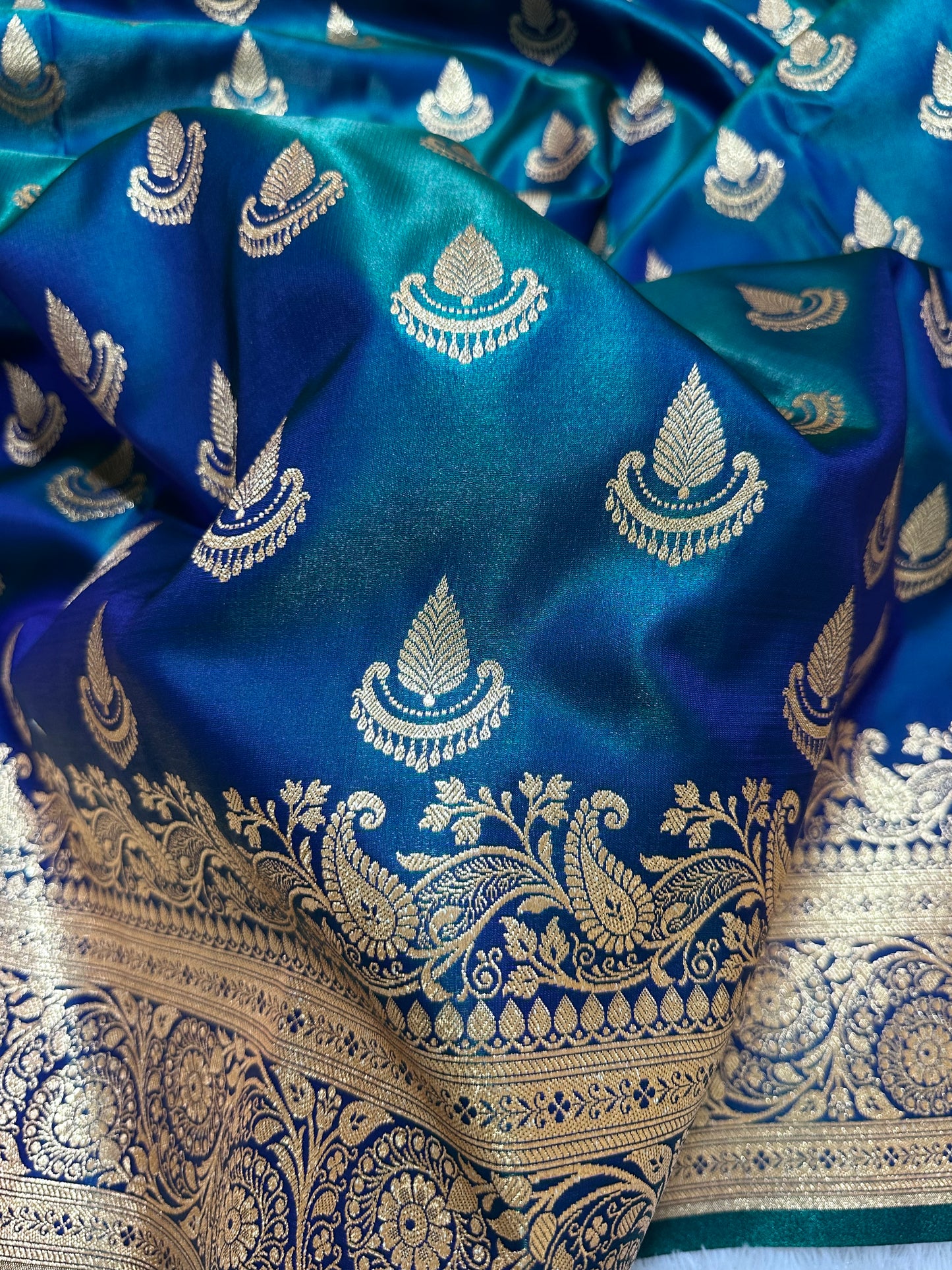 Peacock Dual-Tone Satin Silk Banarasi Saree with Royal Guldasta Chakra Border and Bold Gold Panna Butis