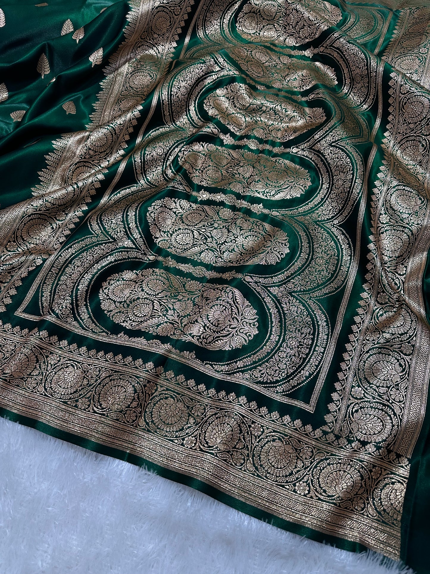 Bottle Green Satin Silk Banarasi Saree with Royal Guldasta Chakra Border and Bold Gold Panna Butis