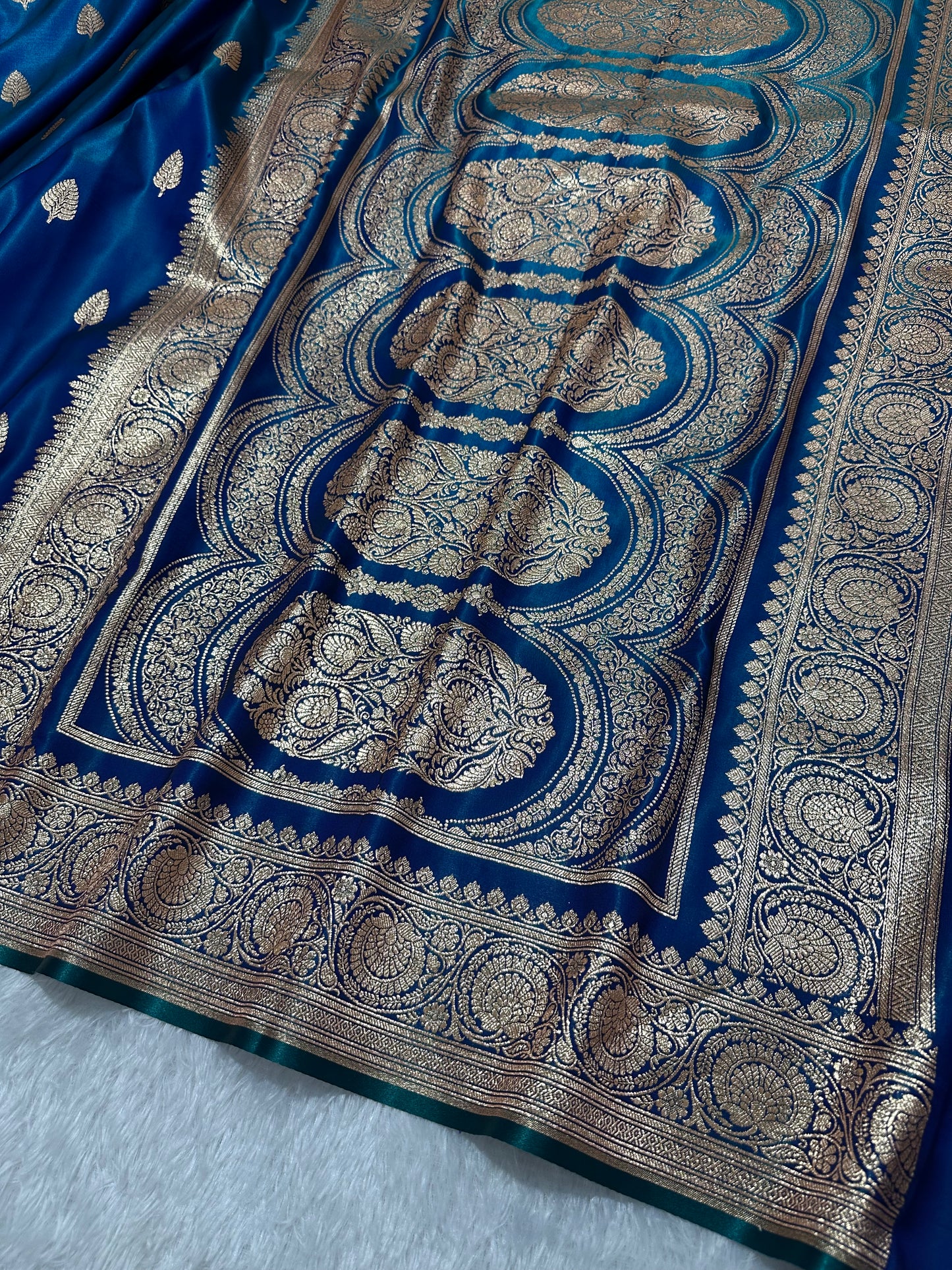 Royal Peacock Blue Satin Silk Banarasi Saree with Royal Guldasta Chakra Border and Bold Gold Panna Butis
