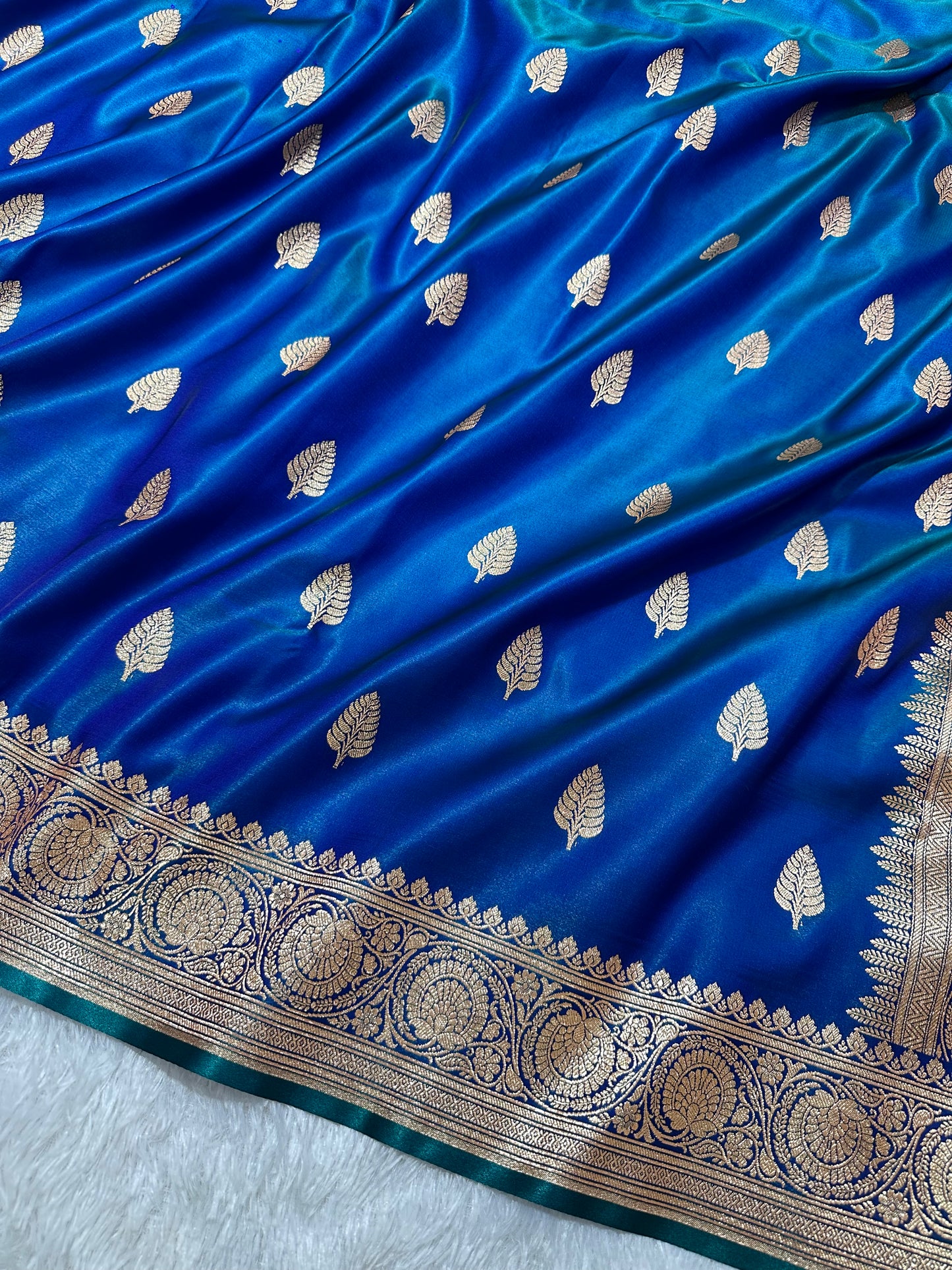 Royal Peacock Blue Satin Silk Banarasi Saree with Royal Guldasta Chakra Border and Bold Gold Panna Butis