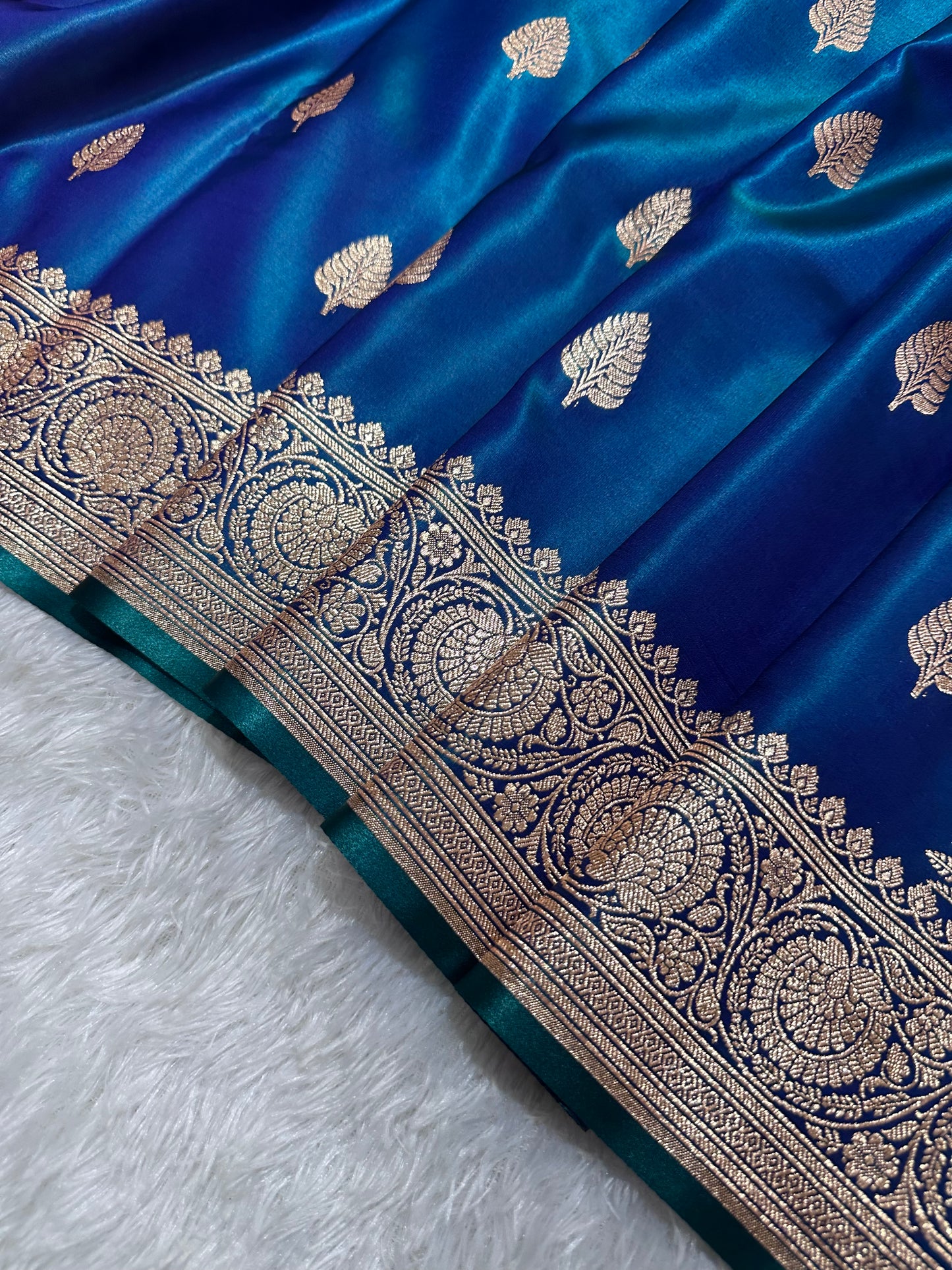 Royal Peacock Blue Satin Silk Banarasi Saree with Royal Guldasta Chakra Border and Bold Gold Panna Butis