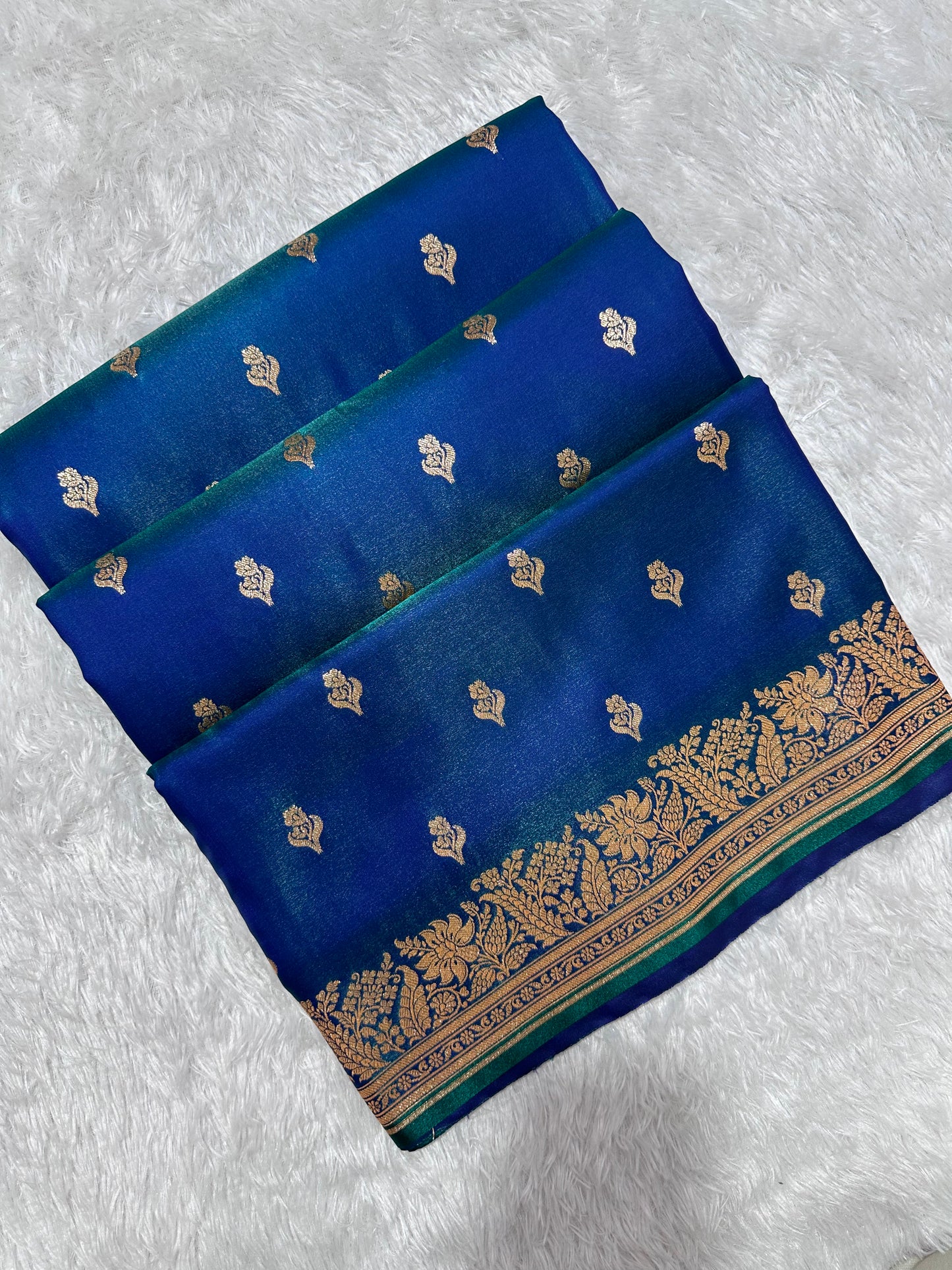 Royal Peacock Blue Satin Silk Banarasi Saree with Delicate Floral Arch Border and Traditional Kalka Butis