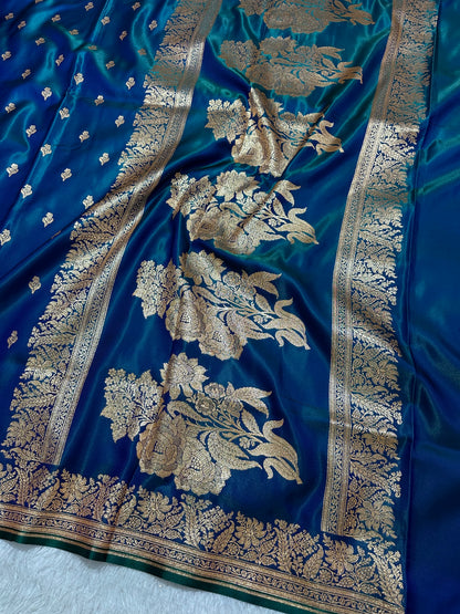 Royal Peacock Blue Satin Silk Banarasi Saree with Delicate Floral Arch Border and Traditional Kalka Butis