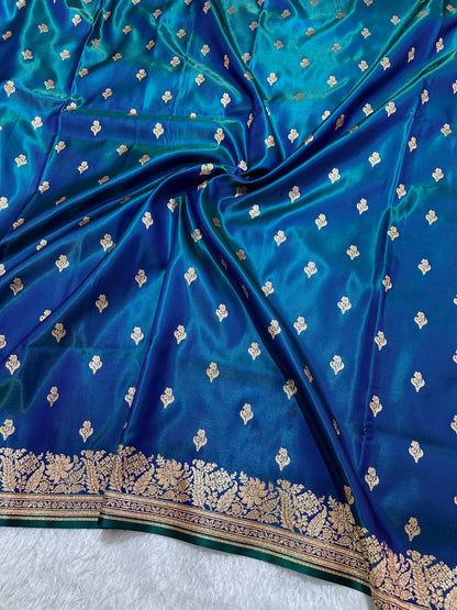 Royal Peacock Blue Satin Silk Banarasi Saree with Delicate Floral Arch Border and Traditional Kalka Butis