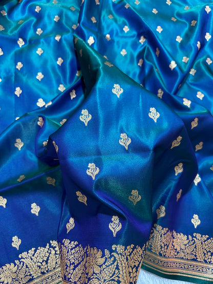 Royal Peacock Blue Satin Silk Banarasi Saree with Delicate Floral Arch Border and Traditional Kalka Butis