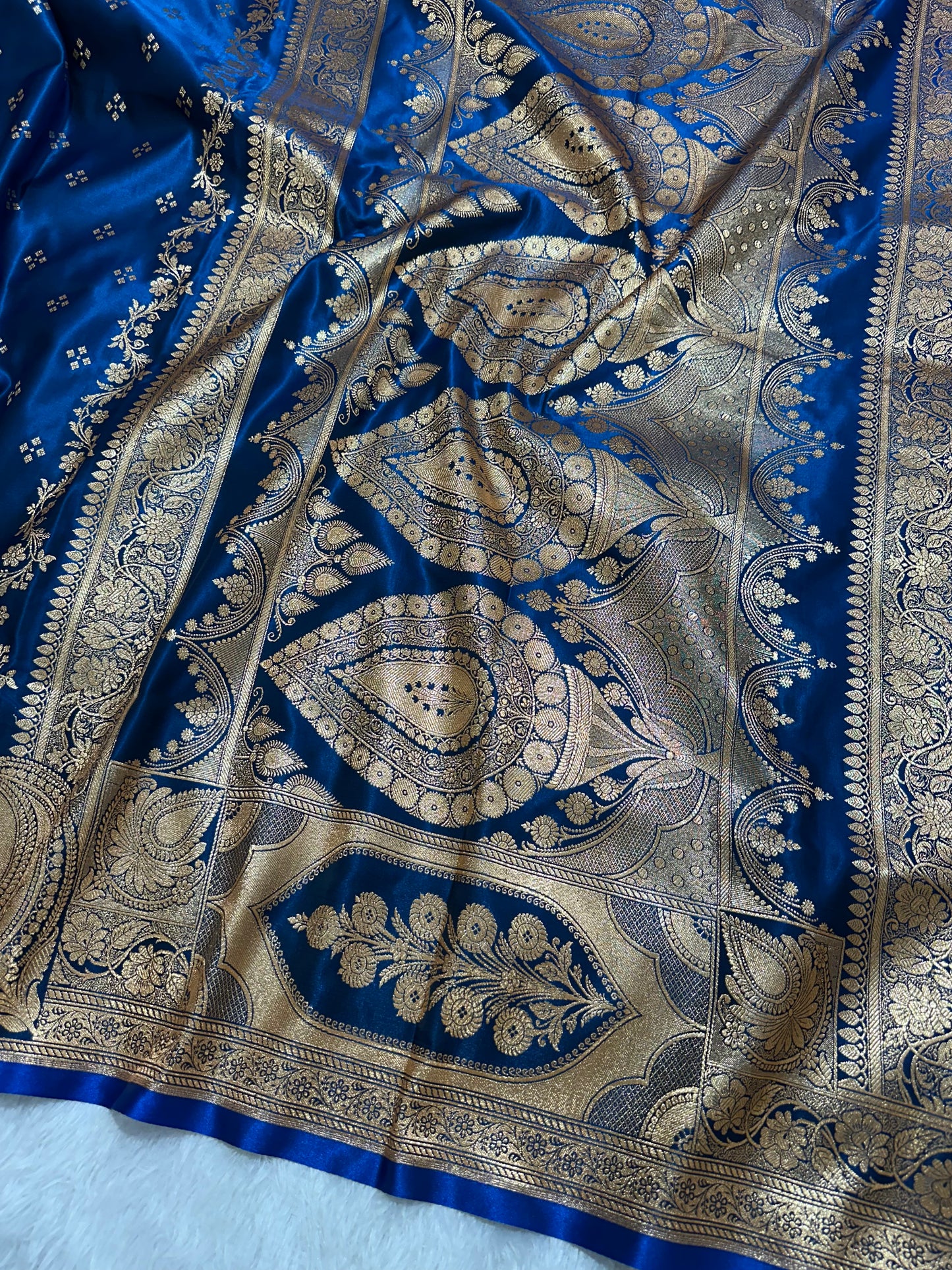 Royal Peacock Blue Satin Silk Banarasi Saree with Royal Floral Jhallar Border and Geometric Chowk Butis