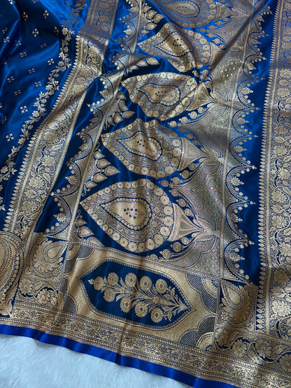 Royal Peacock Blue Satin Silk Banarasi Saree with Royal Floral Jhallar Border and Geometric Chowk Butis