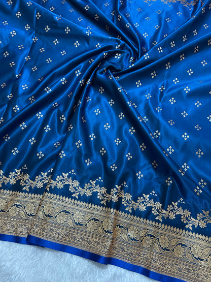 Royal Peacock Blue Satin Silk Banarasi Saree with Royal Floral Jhallar Border and Geometric Chowk Butis