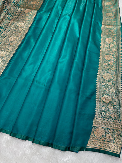 Elegant Rama Green Satin Silk Banarasi Saree with Royal Meena-Floral Border and Ornate Peacock Feather Butis