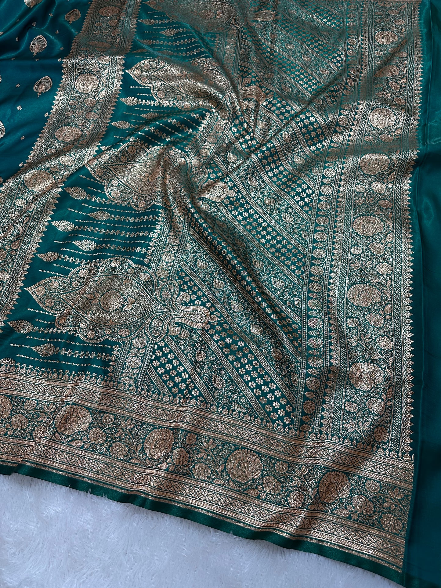 Elegant Rama Green Satin Silk Banarasi Saree with Royal Meena-Floral Border and Ornate Peacock Feather Butis