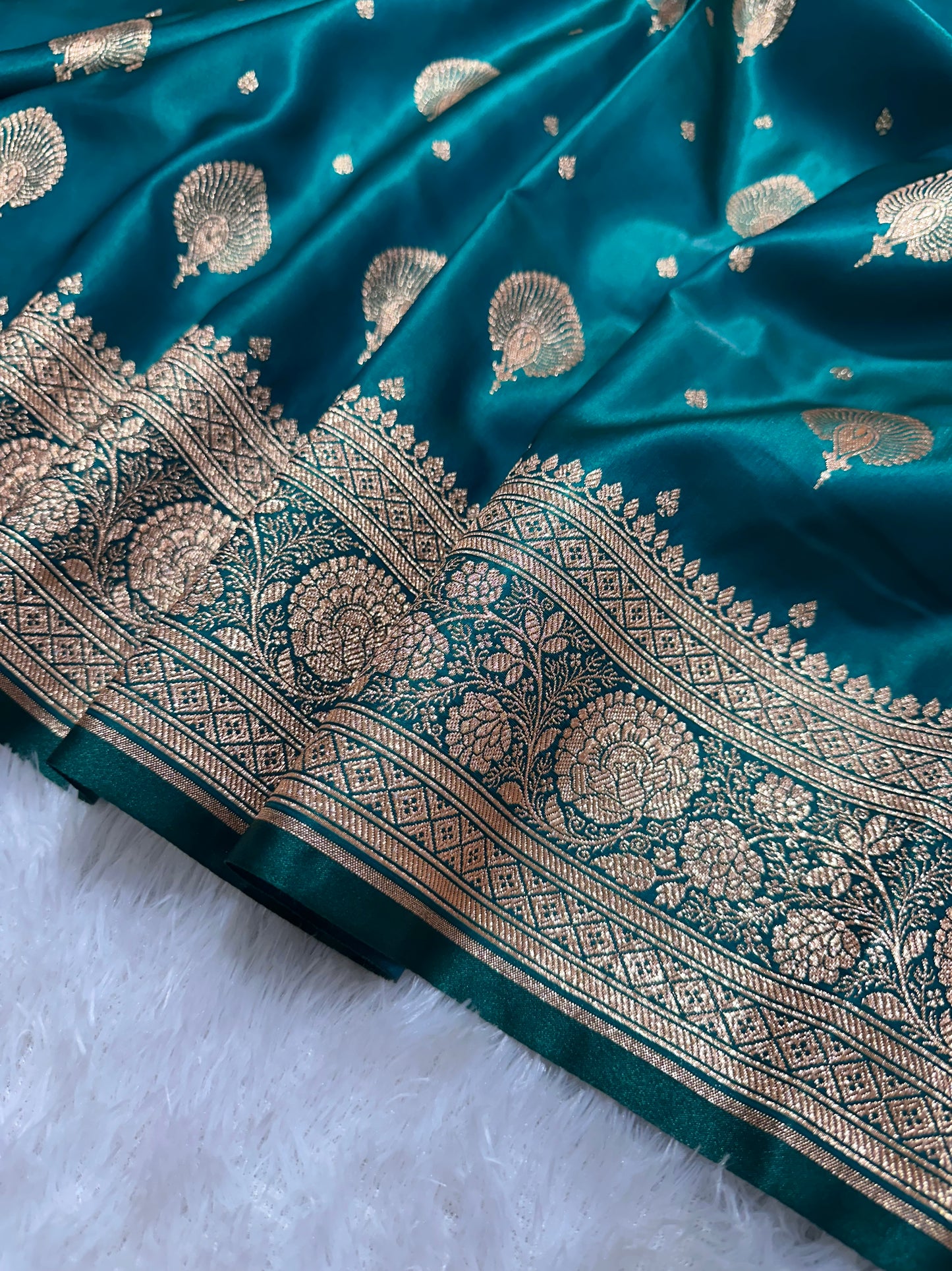 Elegant Rama Green Satin Silk Banarasi Saree with Royal Meena-Floral Border and Ornate Peacock Feather Butis
