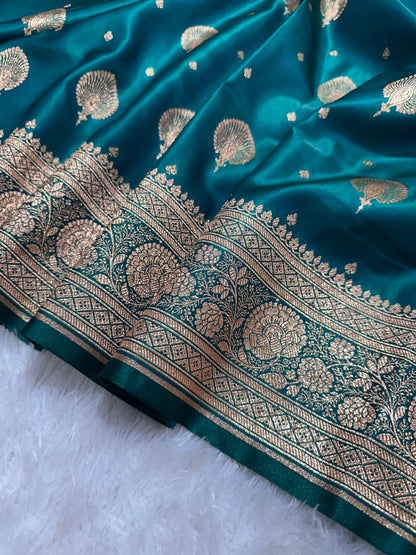Elegant Rama Green Satin Silk Banarasi Saree with Royal Meena-Floral Border and Ornate Peacock Feather Butis