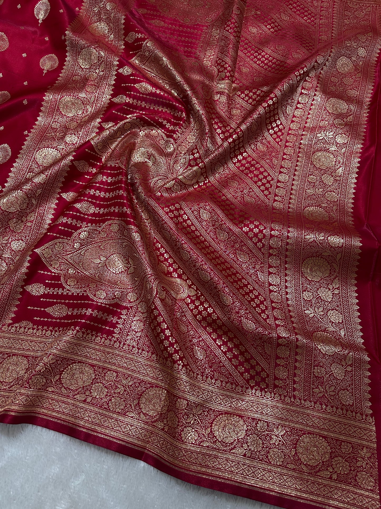 Elegant Crimson Red Satin Silk Banarasi Saree with Royal Meena-Floral Border and Ornate Peacock Feather Butis