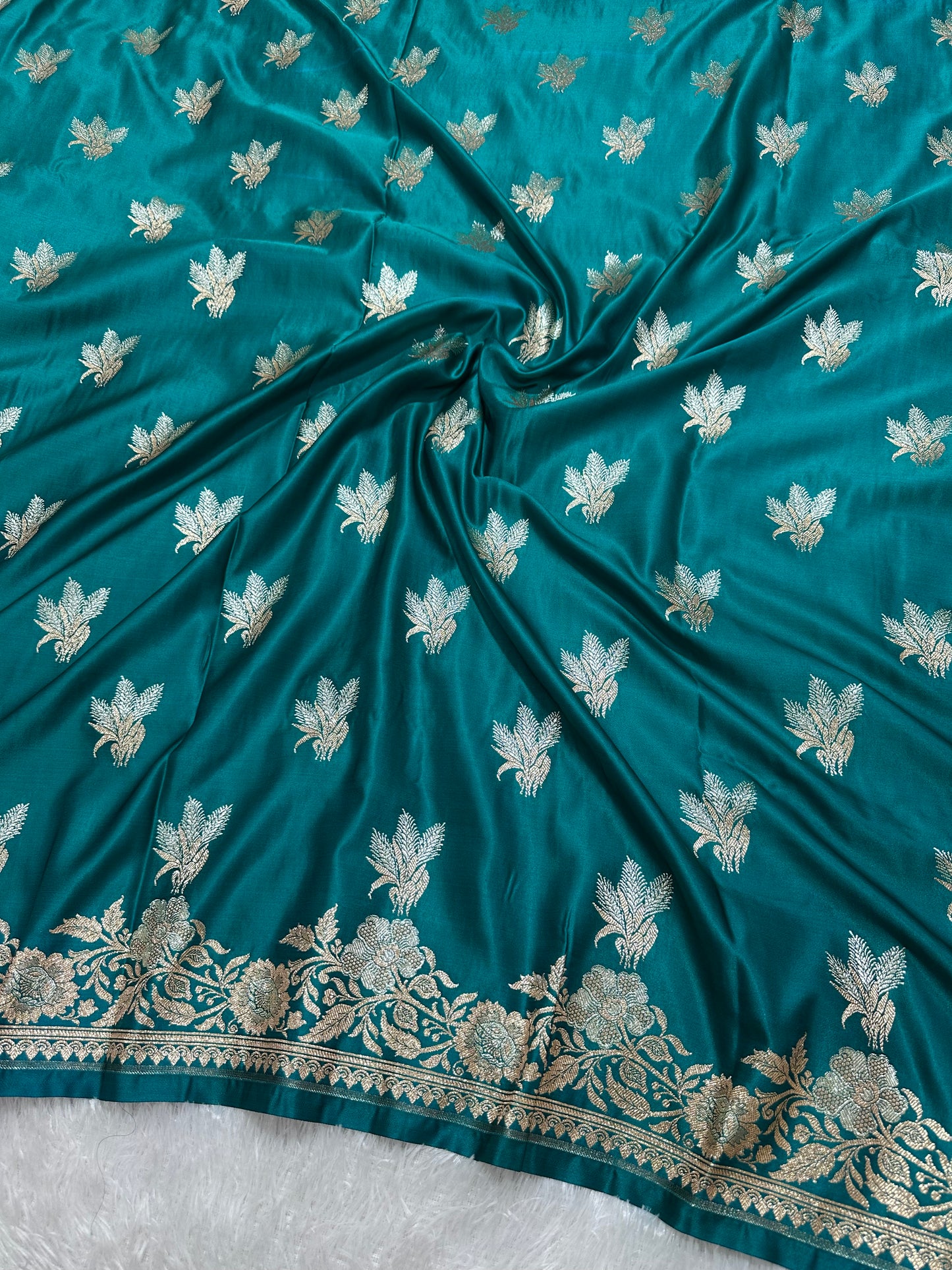 Premium Peacock Blue Katan Silk Banarasi Saree with Delicate Floral Arch Border and Traditional Bouquet Leaf Butis