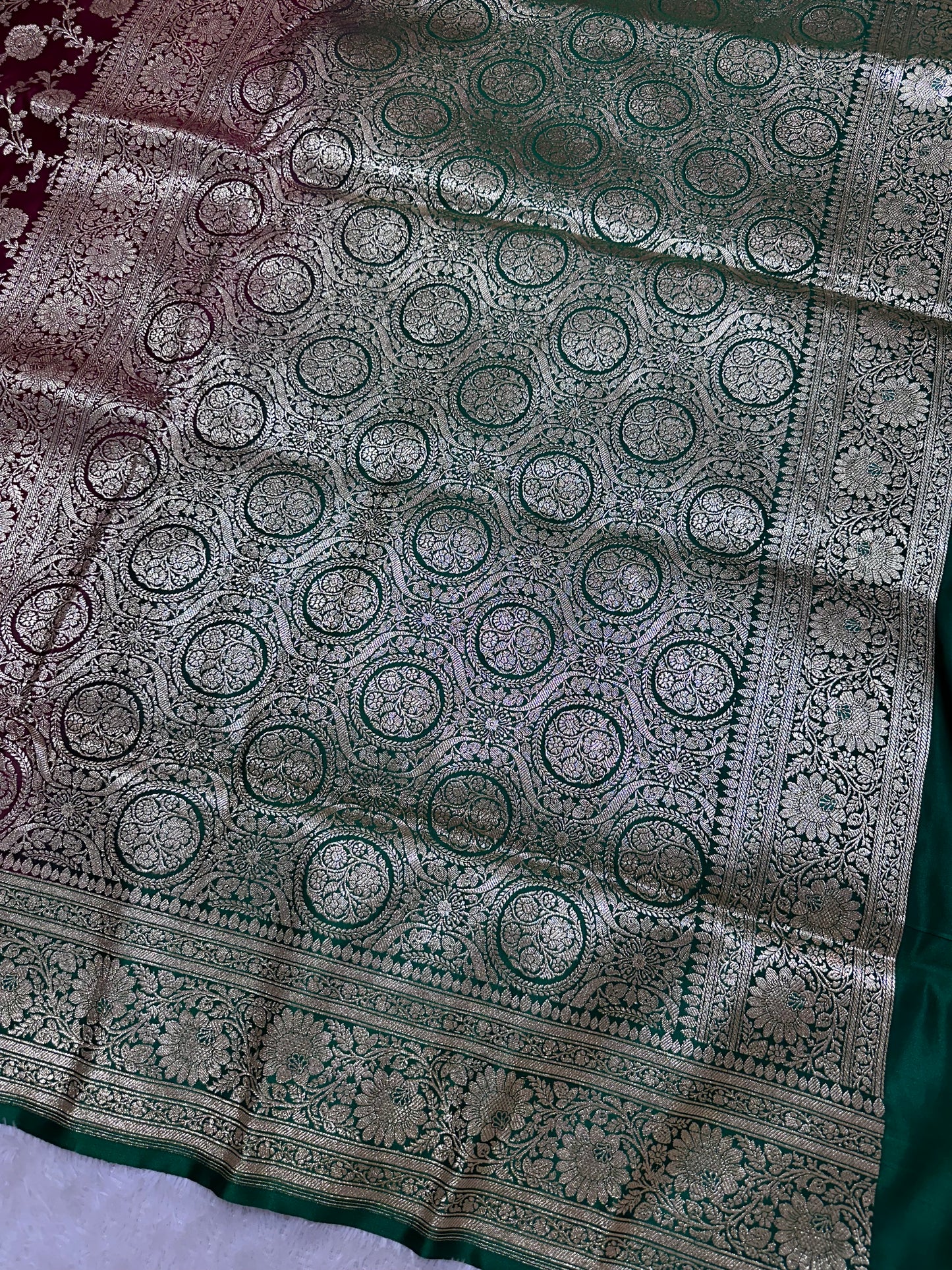 Royal Wine Plum Katan Silk Banarasi Saree with Contrasting Green Border and Full Rose-Vine Jaal Work