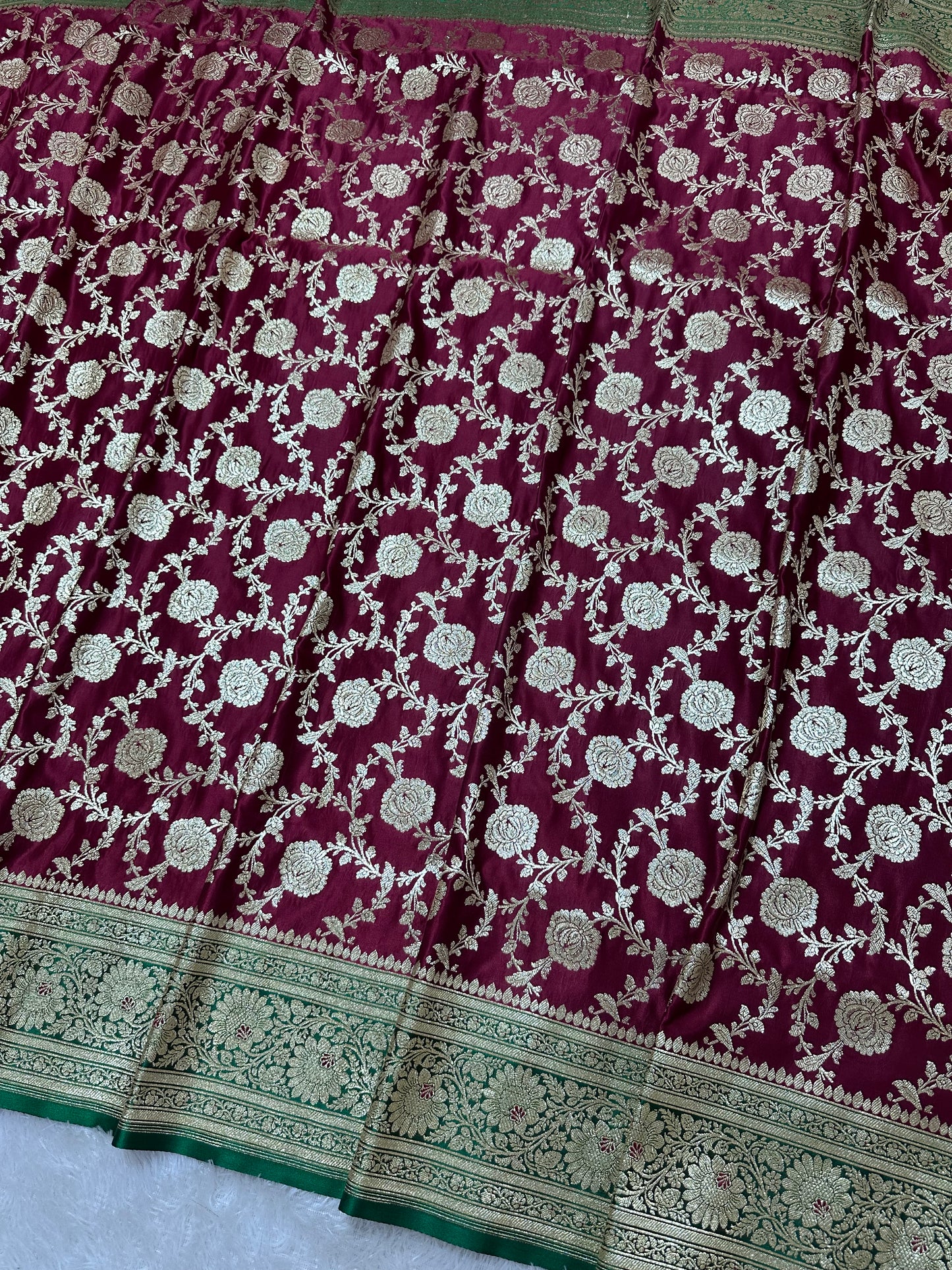 Royal Wine Plum Katan Silk Banarasi Saree with Contrasting Green Border and Full Rose-Vine Jaal Work