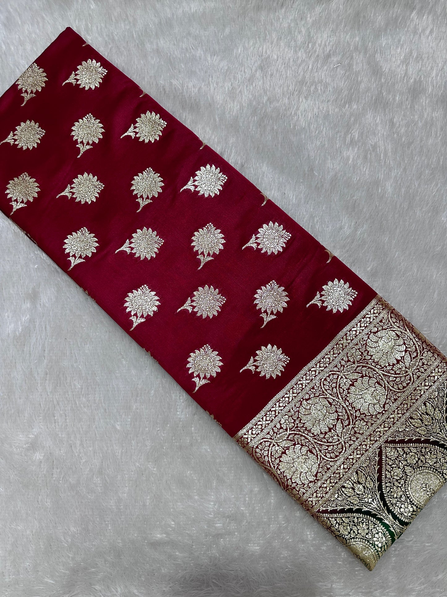 Royal Wine Maroon Katan Silk Banarasi Saree with Contrasting Green Border and Traditional Sunflower Butis
