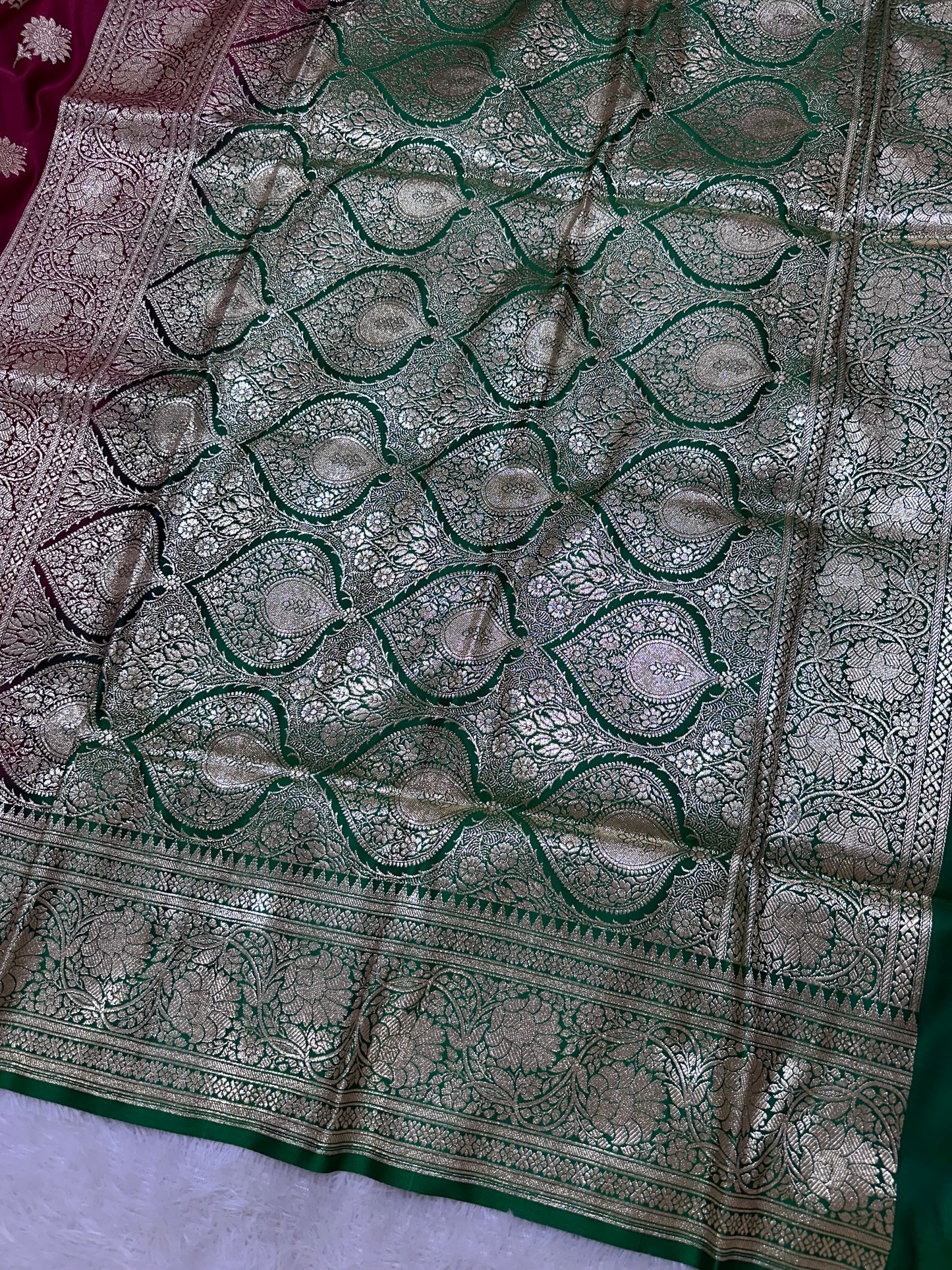Royal Wine Maroon Katan Silk Banarasi Saree with Contrasting Green Border and Traditional Sunflower Butis