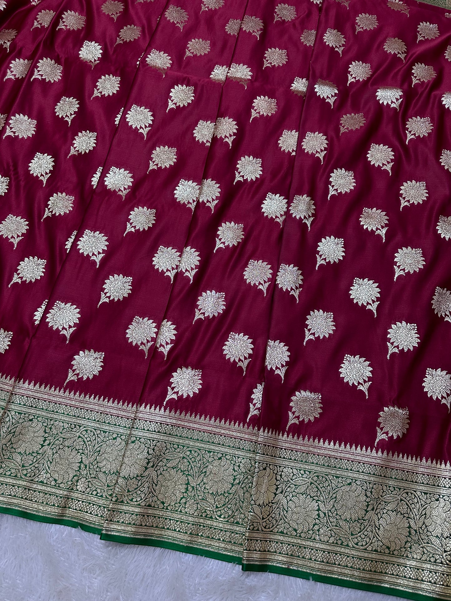 Royal Wine Maroon Katan Silk Banarasi Saree with Contrasting Green Border and Traditional Sunflower Butis