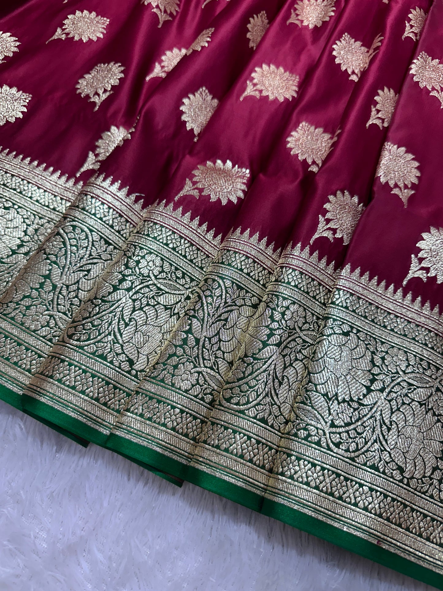 Royal Wine Maroon Katan Silk Banarasi Saree with Contrasting Green Border and Traditional Sunflower Butis