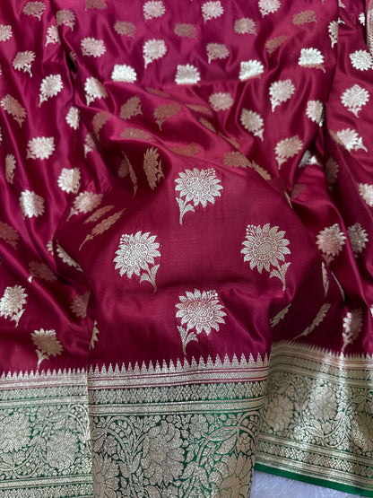 Royal Wine Maroon Katan Silk Banarasi Saree with Contrasting Green Border and Traditional Sunflower Butis